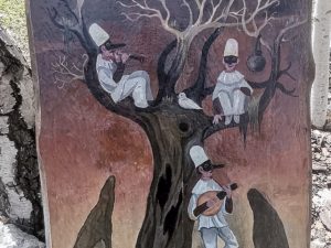 Pannello I tre Pulcinella su tinte calde